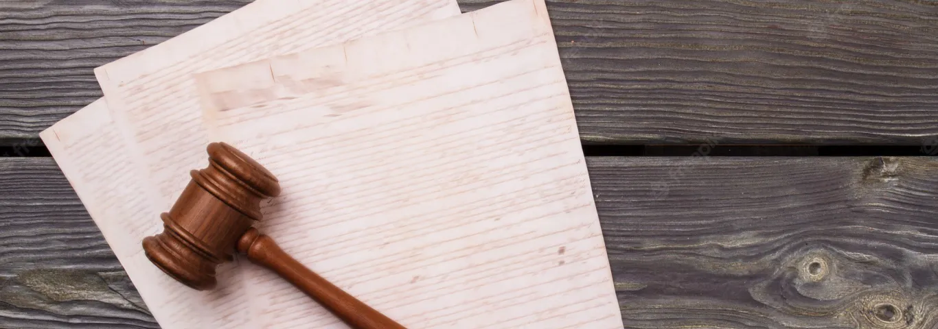 A Wooden Gavel and Papers